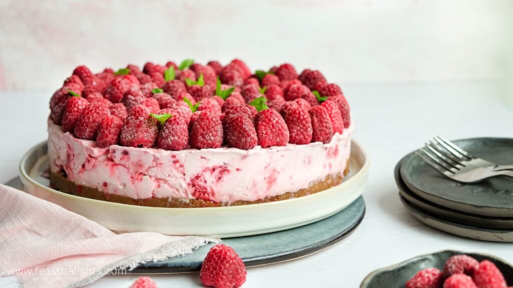 Raspberry Cheesecake with Warm Berry Syrup
